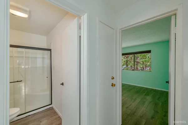 a room with wooden floor and closet