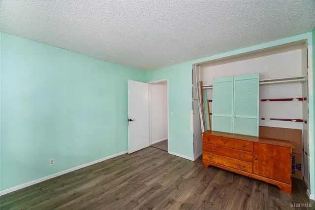 a view of a backyard with swimming pool