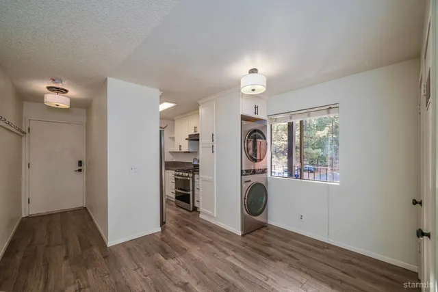 a view of a hallway with washer and dryer