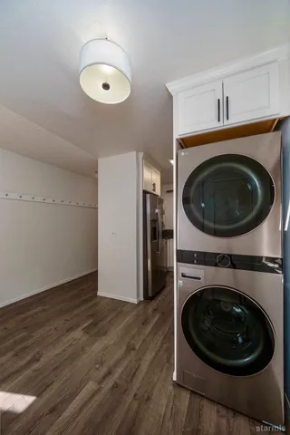 a kitchen with granite countertop a stove and a sink