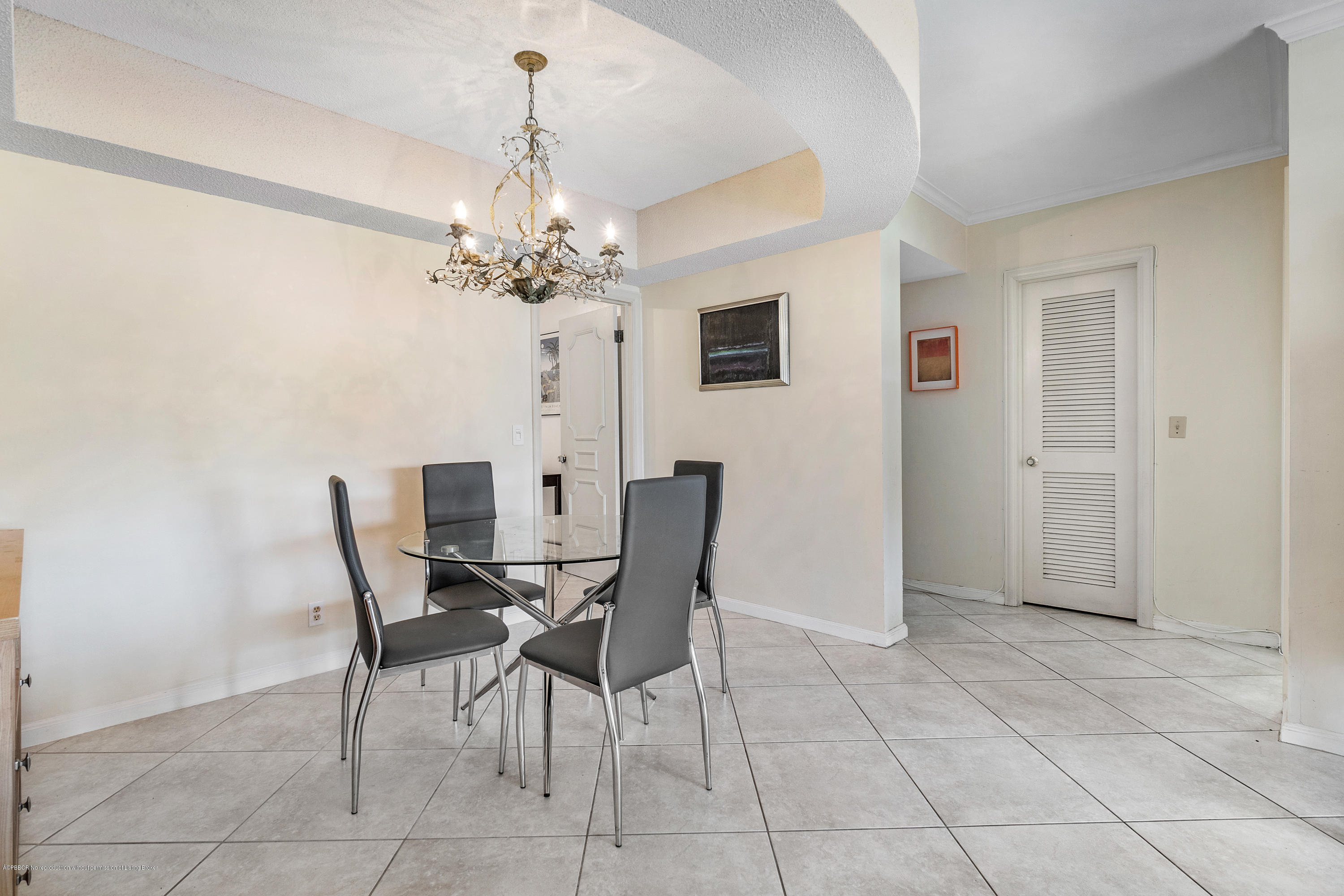 2185 Ibis Isle Road, Unit 40 Palm Beach, FL 33480 - Photo 12 of 28 a view of a dining room with furniture and chandelier