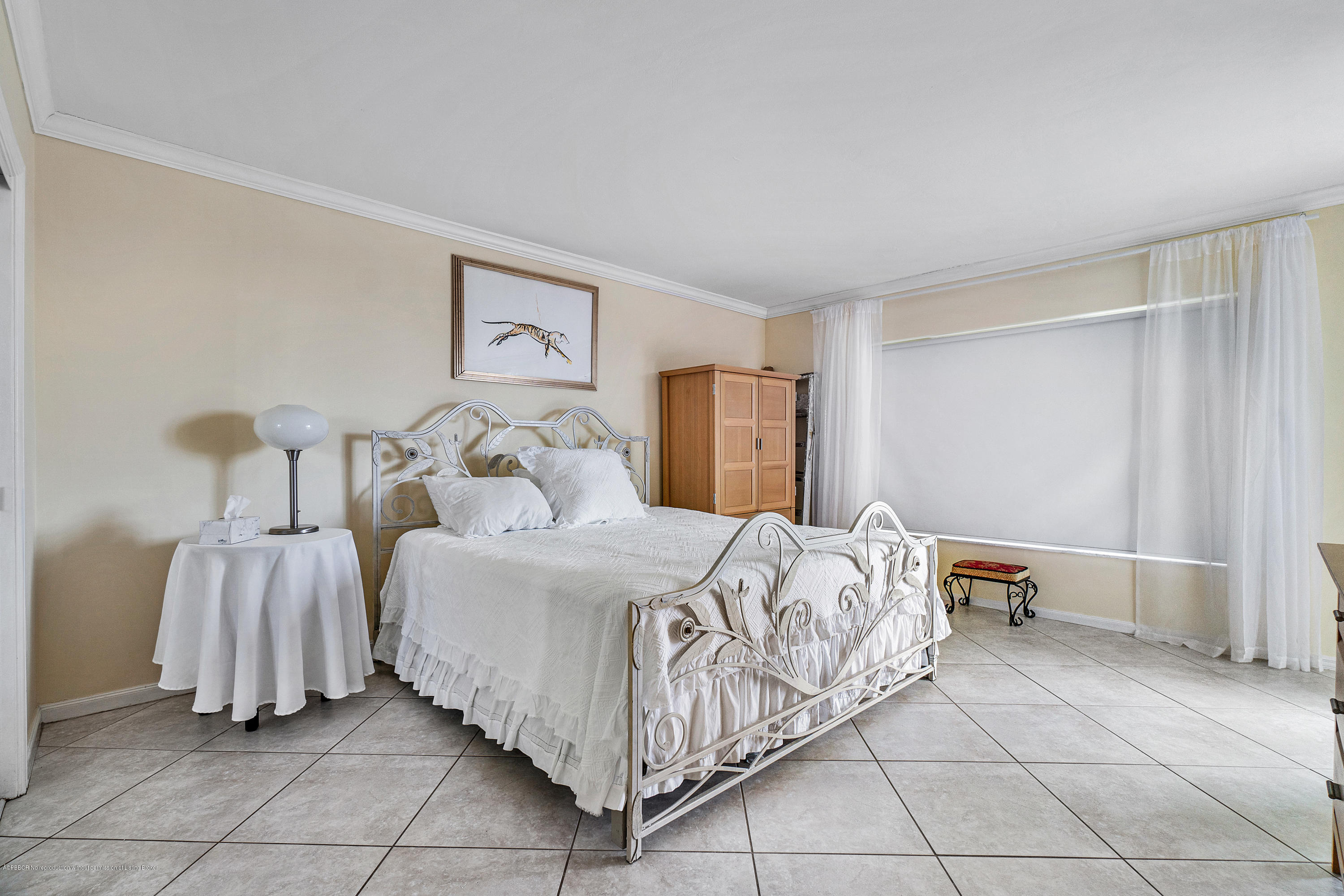 2185 Ibis Isle Road, Unit 40 Palm Beach, FL 33480 - Photo 16 of 28 a bed room with a bed and a chair