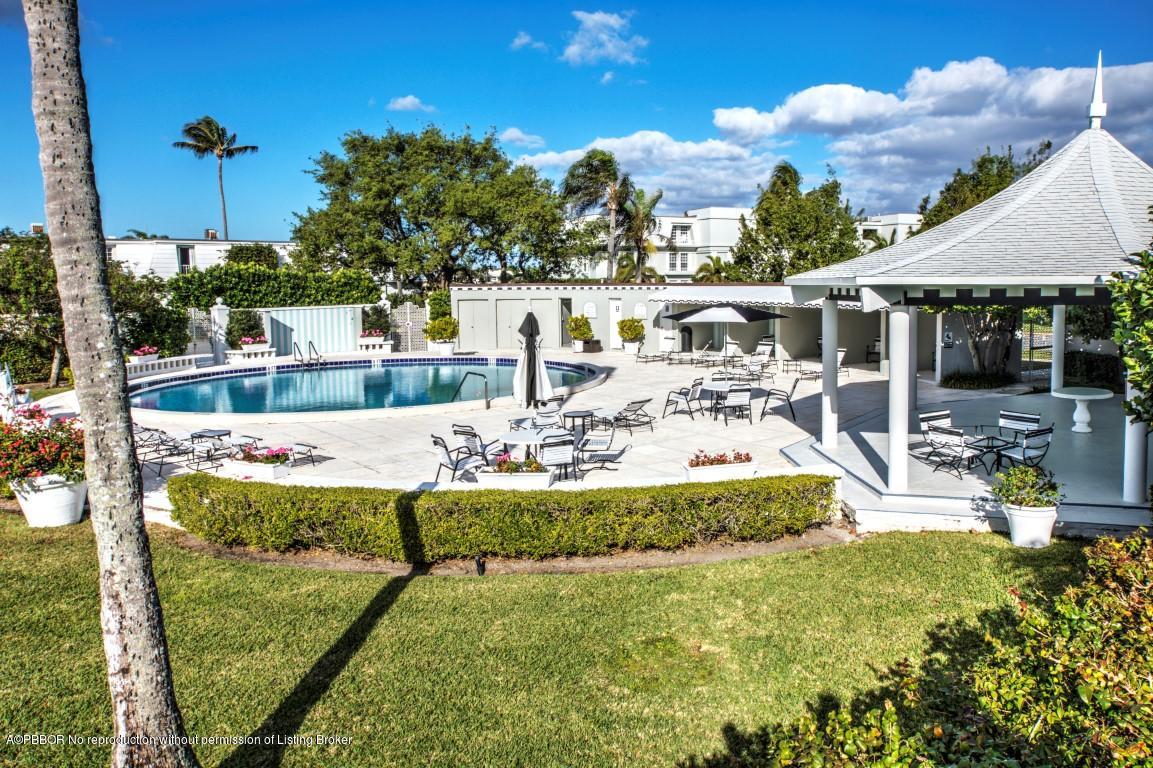 2185 Ibis Isle Road, Unit 40 Palm Beach, FL 33480 - Photo 24 of 28 a view of a swimming pool with a patio