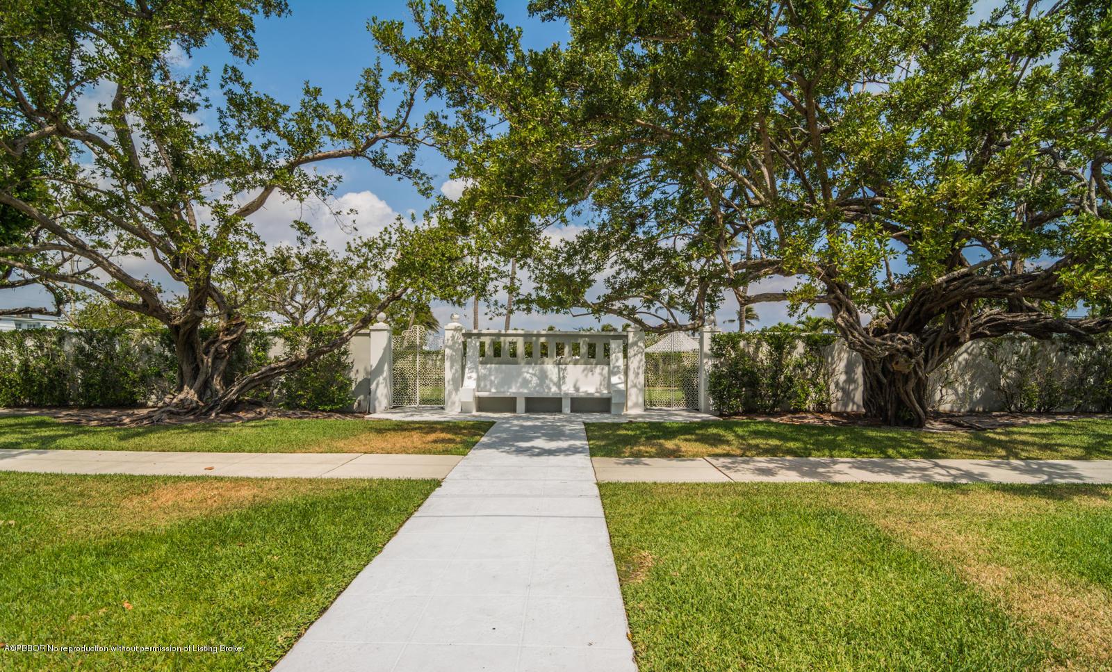 2185 Ibis Isle Road, Unit 40 Palm Beach, FL 33480 - Photo 27 of 28 a view of a house with a big yard and palm trees