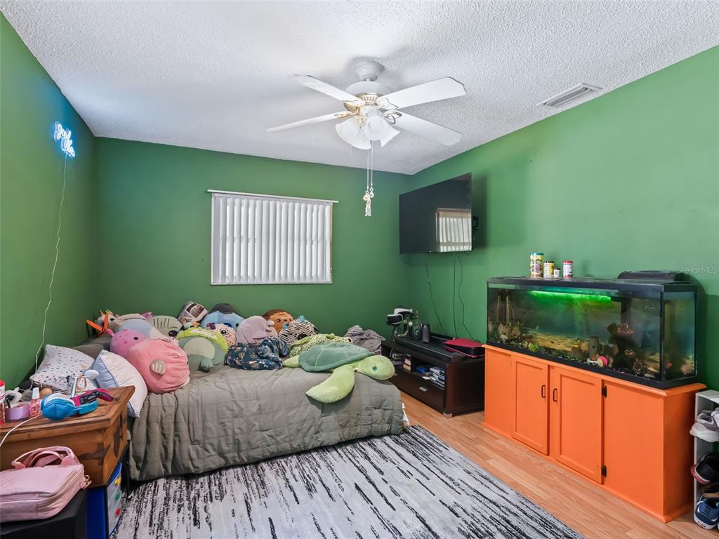 6046 East Loring Lane Inverness, FL 34452 - Photo 35 of 46 a bedroom with a bed and windows