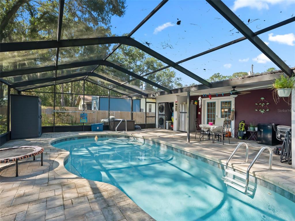 6046 East Loring Lane Inverness, FL 34452 - Photo 46 of 46 a front view of a house with swimming pool and sitting area