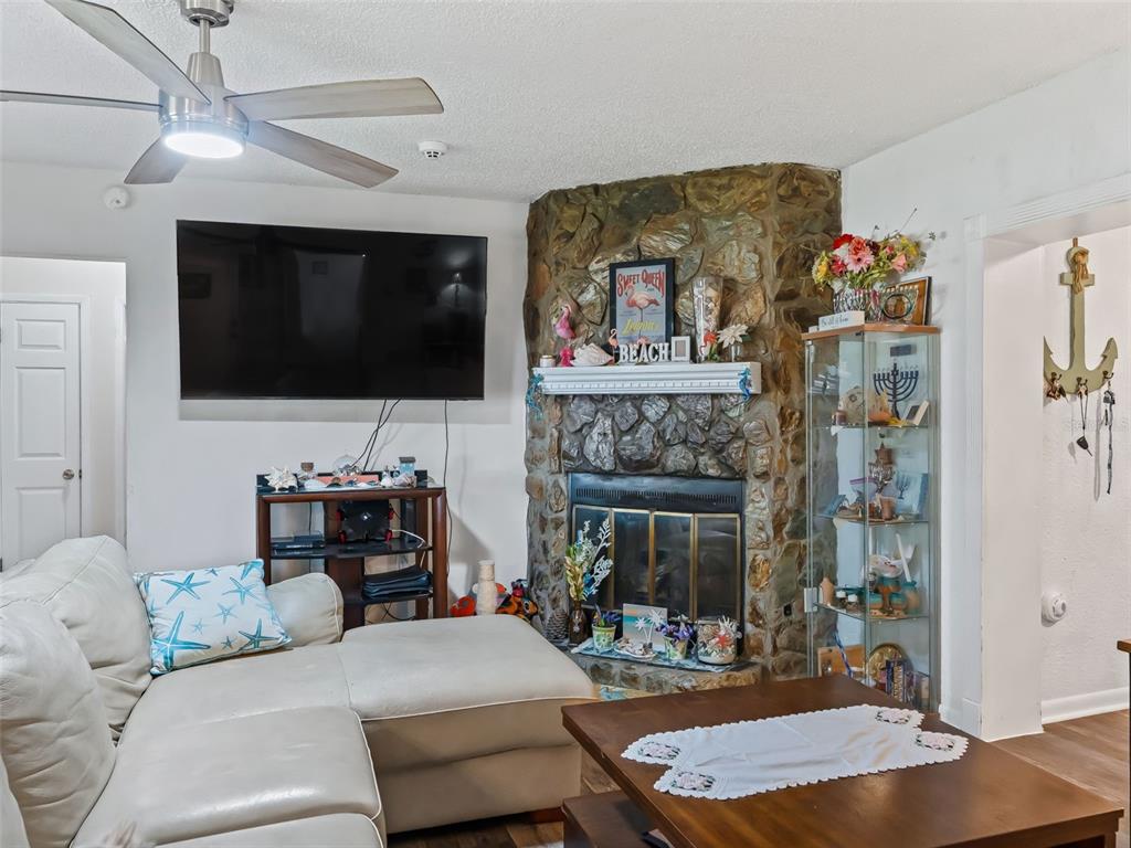 6046 East Loring Lane Inverness, FL 34452 - Photo 7 of 46 a living room with furniture and a flat screen tv