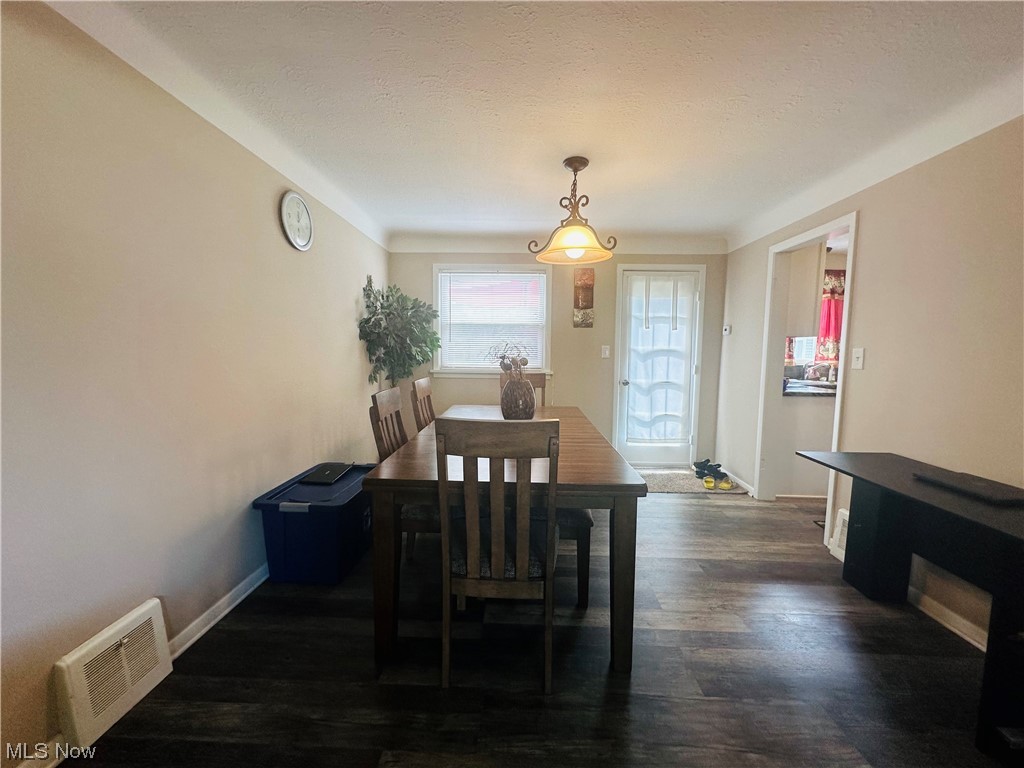 3894 Salisbury Road South Euclid, OH 44121 - Photo 4 of 16 Dining room featuring a textured ceiling and dark hardwood floors