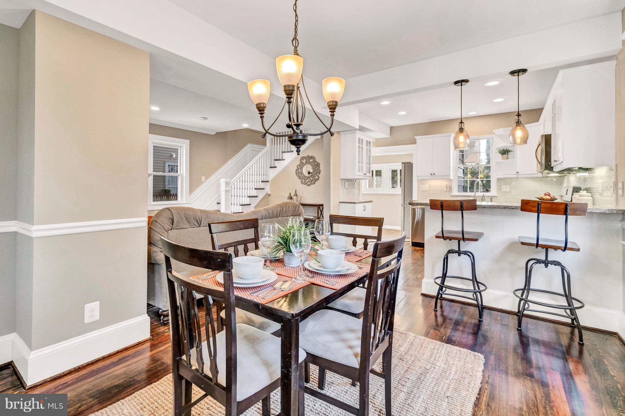 605 St Dunstans Road Baltimore, MD 21212 - Photo 11 of 43 a view of a dining room with furniture and wooden floor