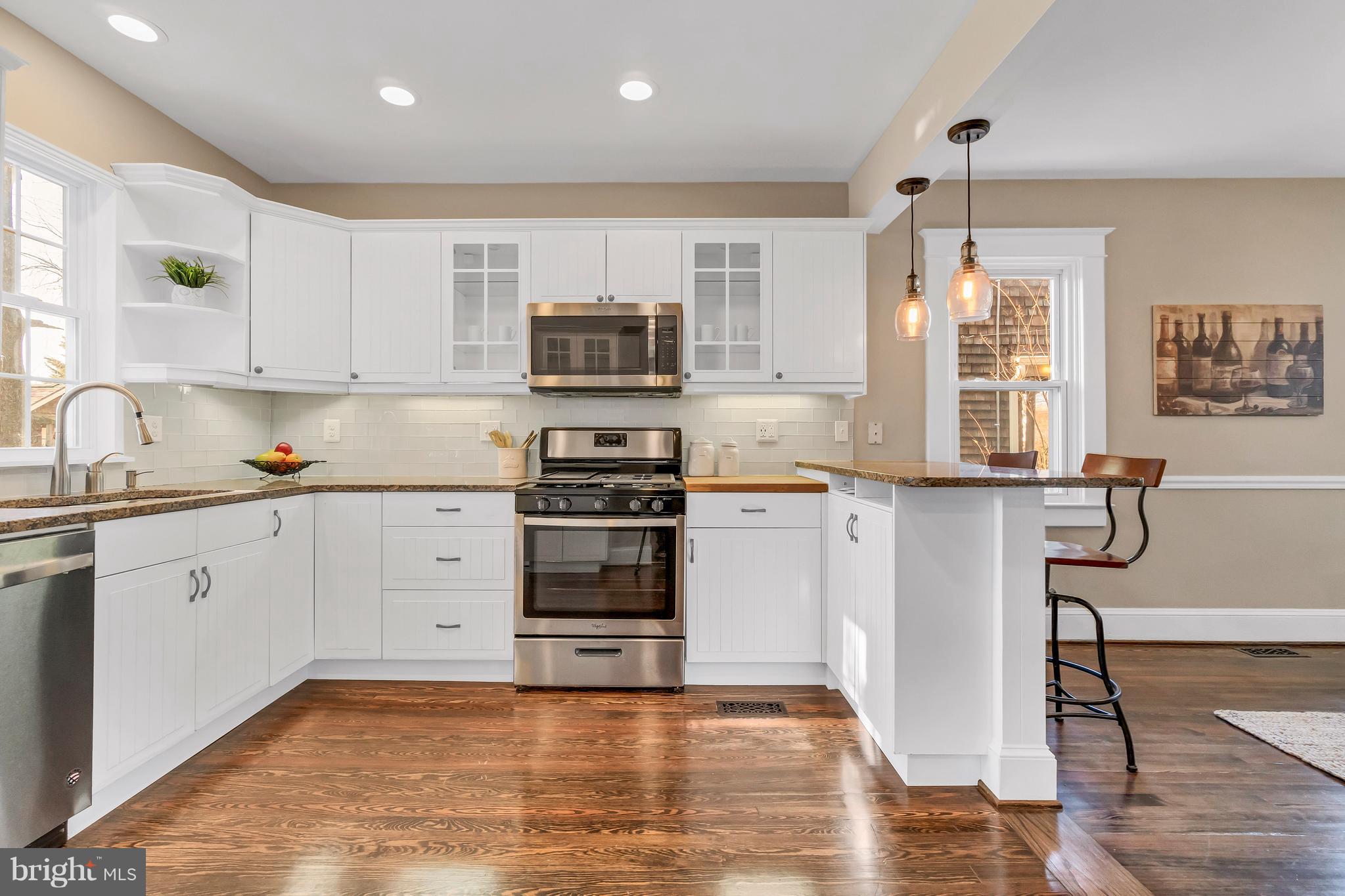 605 St Dunstans Road Baltimore, MD 21212 - Photo 12 of 43 a kitchen with stainless steel appliances a stove top oven and a refrigerator