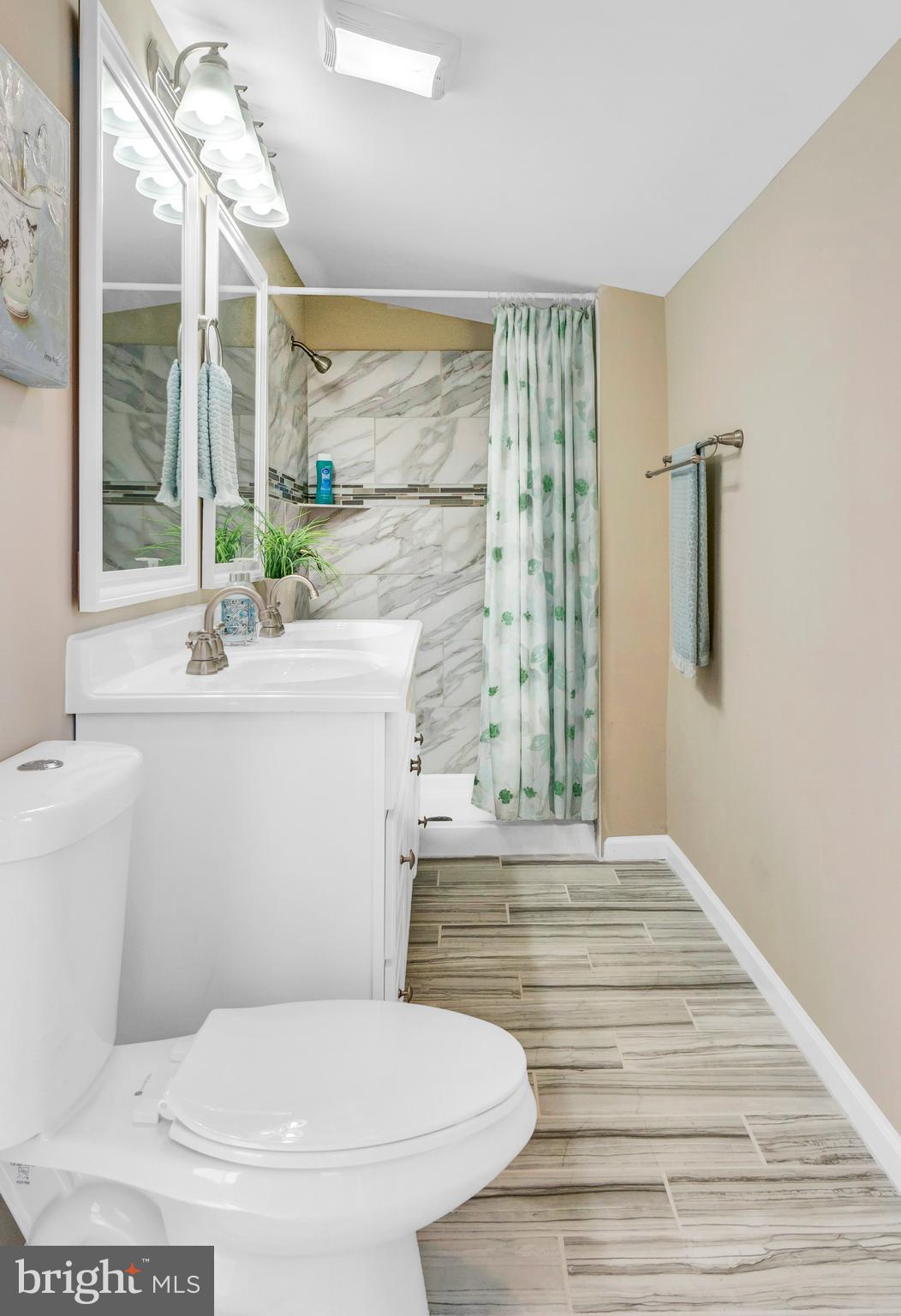 605 St Dunstans Road Baltimore, MD 21212 - Photo 24 of 43 a bathroom with a sink toilet and shower