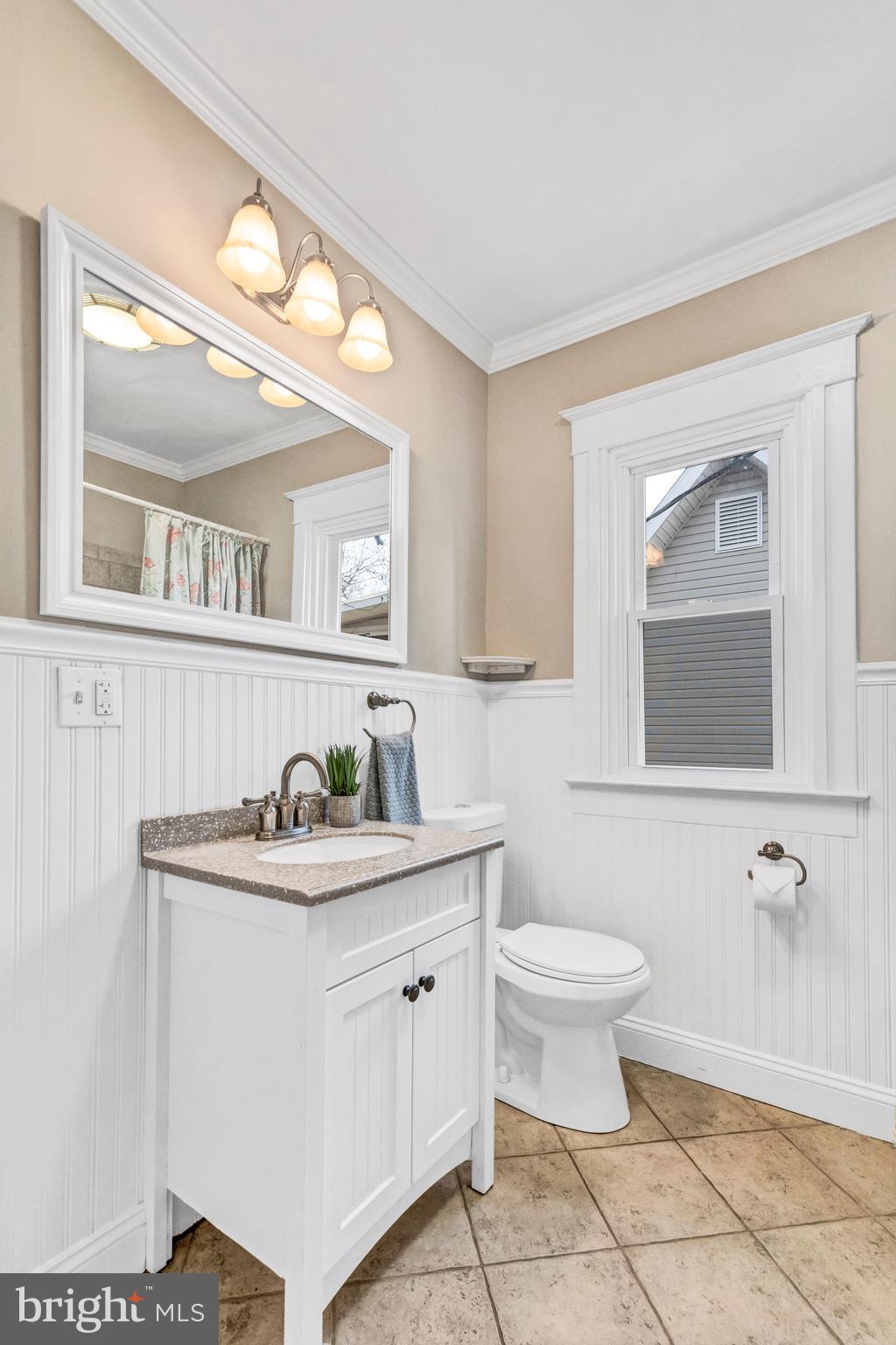 605 St Dunstans Road Baltimore, MD 21212 - Photo 29 of 43 a bathroom with a sink a toilet and mirror