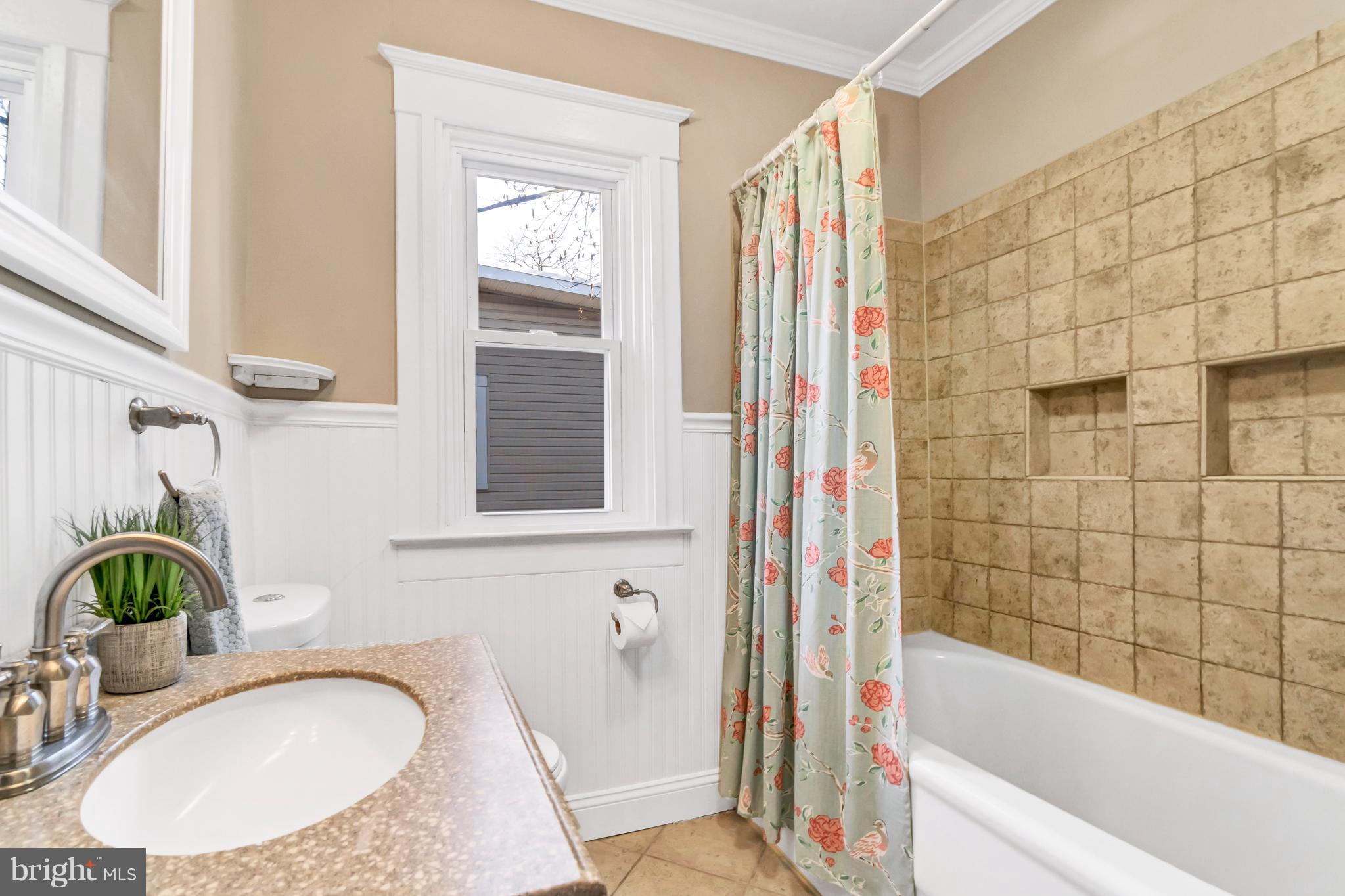 605 St Dunstans Road Baltimore, MD 21212 - Photo 30 of 43 a bathroom with a granite countertop sink and a mirror