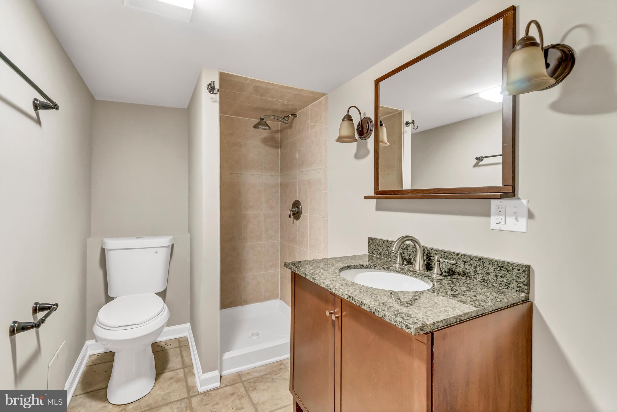 605 St Dunstans Road Baltimore, MD 21212 - Photo 38 of 43 a bathroom with a sink toilet and shower