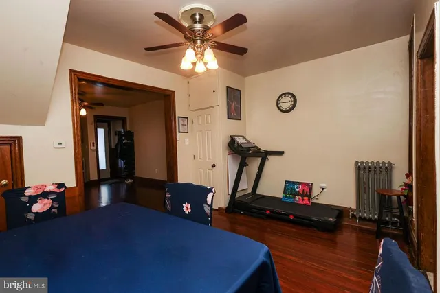 a room with gym equipment and a mirror