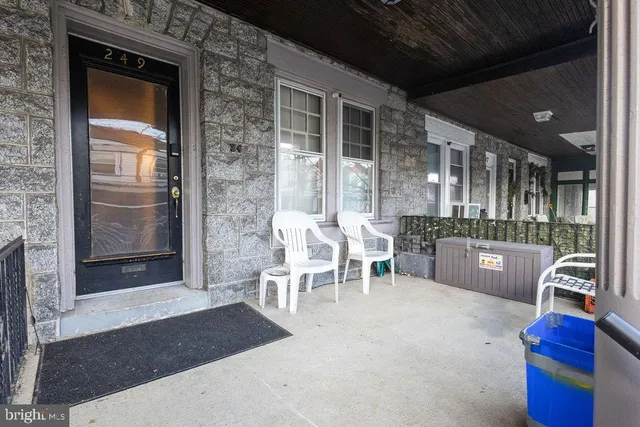 a living room with furniture a dining table and chairs