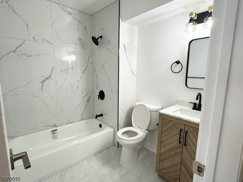 76 Jamestown Road Bernards, NJ 07920 - Photo 4 of 20 a bathroom with a sink a toilet and a bathtub