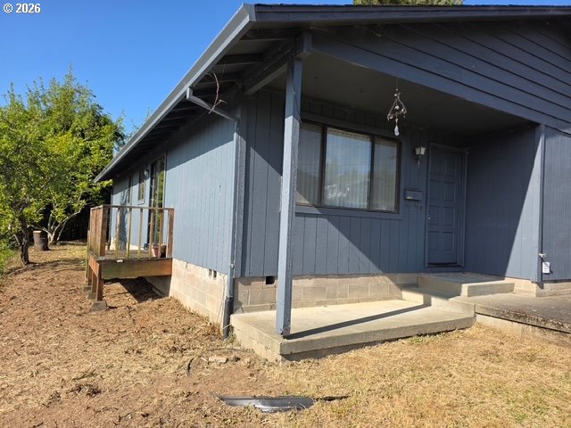 1125 Maple Street Myrtle Point, OR 97458 - Photo 2 of 4 a view of a house with backyard