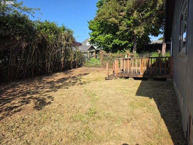 1125 Maple Street Myrtle Point, OR 97458 - Photo 3 of 4 a view of wooden fence and trees around