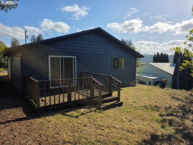 1125 Maple Street Myrtle Point, OR 97458 - Photo 4 of 4 a view of a roof deck with wooden fence and a floor