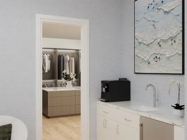 a kitchen with a refrigerator and a sink