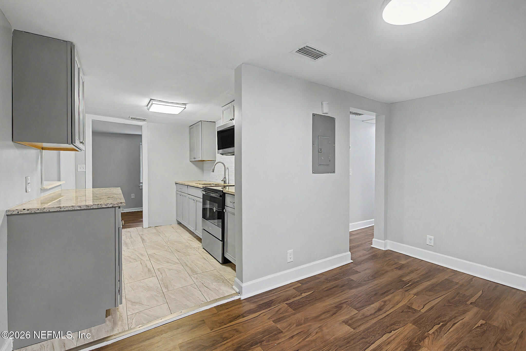 2625 Kohn Road Jacksonville, FL 32210 - Photo 10 of 34 a view of a kitchen with wooden floor and a kitchen