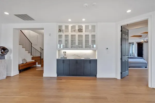 a large spacious bathroom with a tub double sink and mirrors