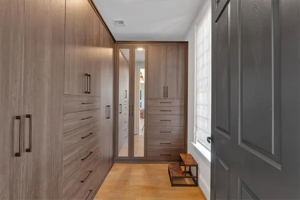a large bathroom with a double vanity sink and a mirror