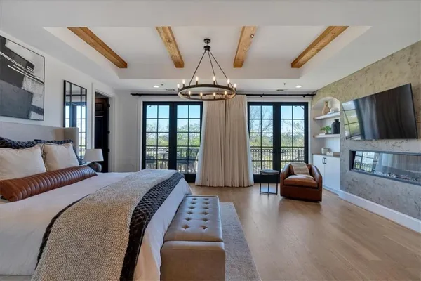 a bathroom with a double vanity sink toilet mirror and shower