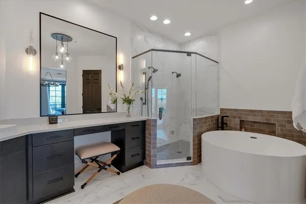 a living room with furniture a chandelier and a dining table