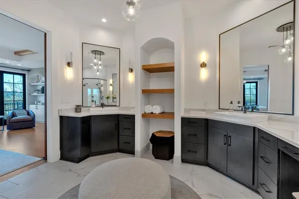 a kitchen with stainless steel appliances kitchen island granite countertop a refrigerator and a sink