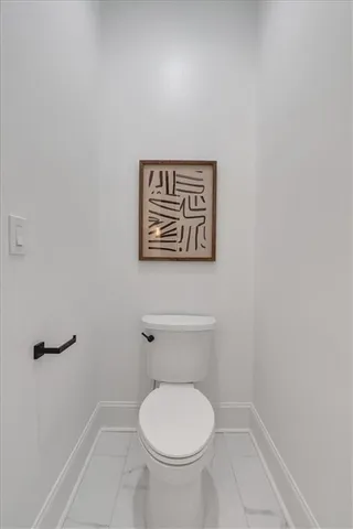 a living room with furniture a rug and wall painting