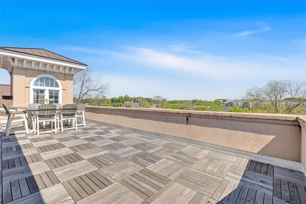 an aerial view of a house with a swimming pool and mountains