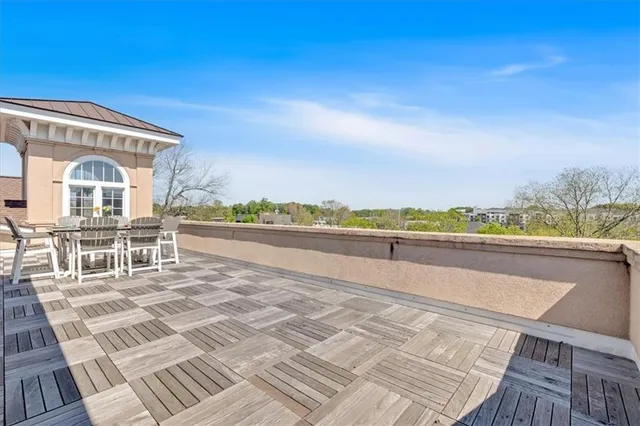 an aerial view of a house with a swimming pool and mountains