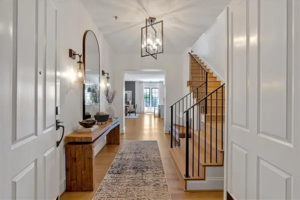 a living room with fireplace furniture and a large window