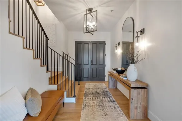 a view of front door with wooden floor
