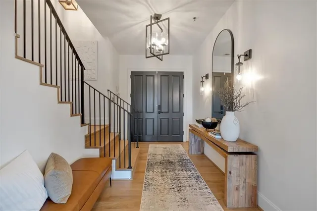 a view of front door with wooden floor