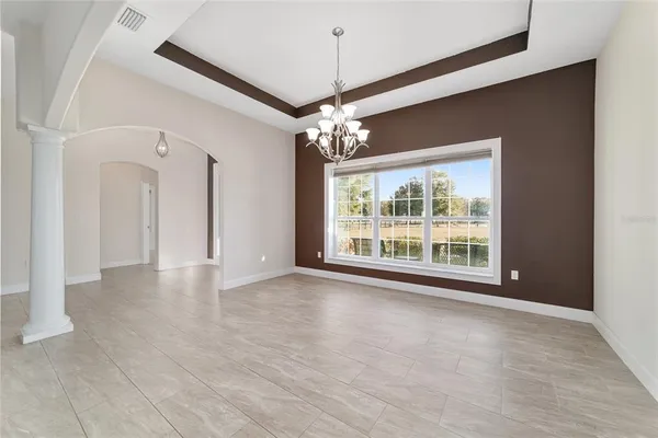 a bathroom with a granite countertop sink a mirror bathtub and shower