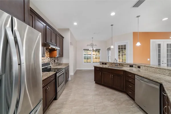 a view of a room with wooden floor and fence