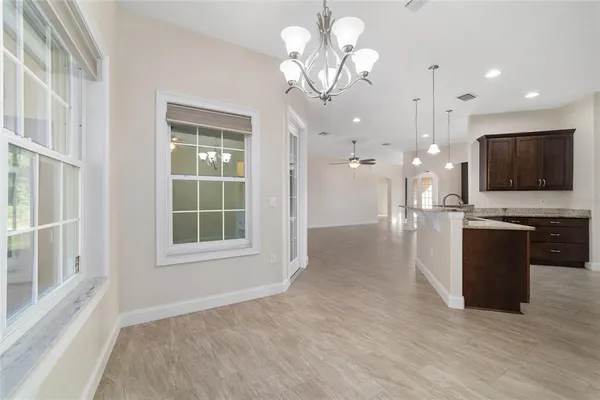 a view of a room with wooden floor and fence