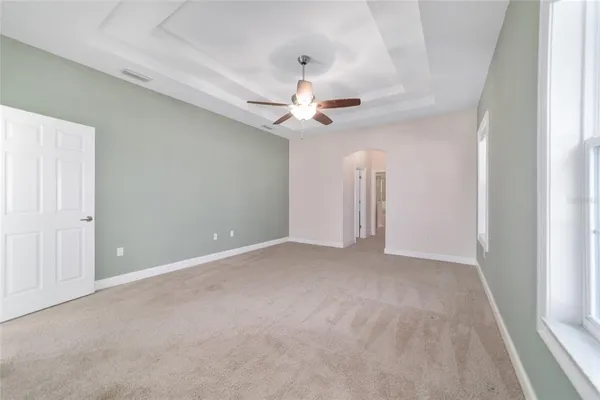 a view of a house with a yard and sitting area