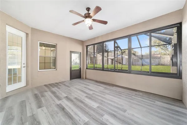 a view of an empty room with a window