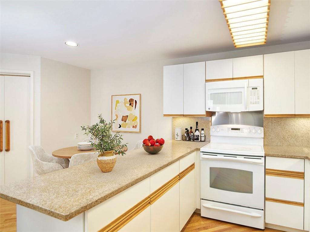 5000 5th, Unit 101 Pittsburgh, PA 15232 - Photo 14 of 38 Kitchen, eat-in-area and closet to the laundry.