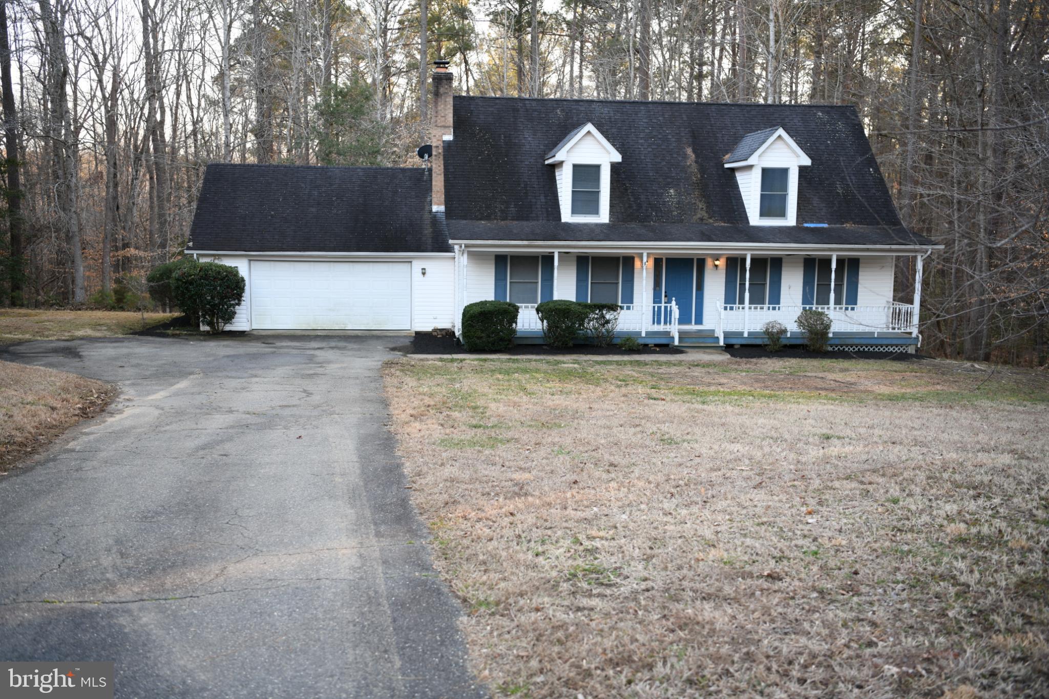 20503 Chestnut Ridge Drive Leonardtown, MD 20650 - Photo 1 of 36 a front view of a house with a yard