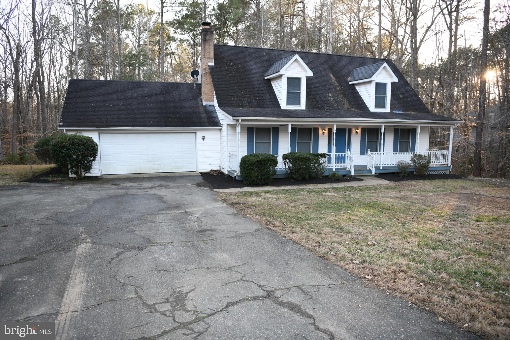 20503 Chestnut Ridge Drive Leonardtown, MD 20650 - Photo 2 of 36 a front view of a house with a yard