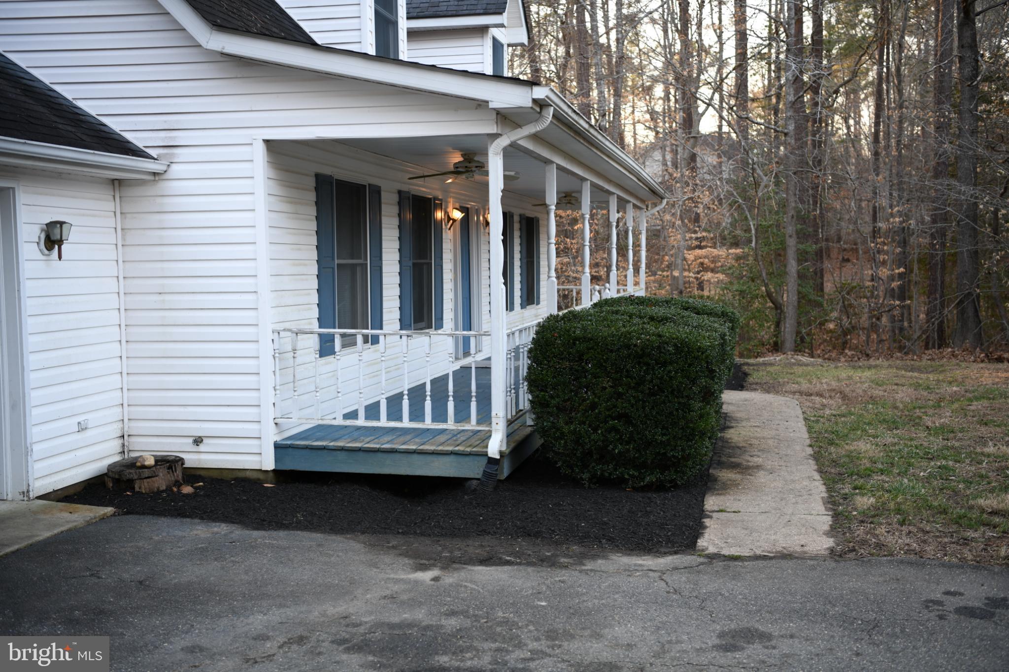 20503 Chestnut Ridge Drive Leonardtown, MD 20650 - Photo 7 of 36 a front view of a house with a yard