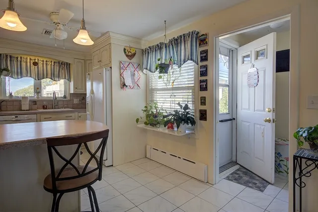 a view of a hallway and dining room