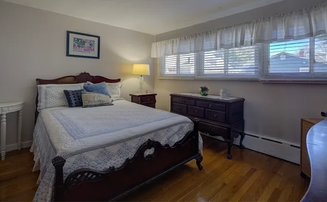 a bedroom with a bed and a desk