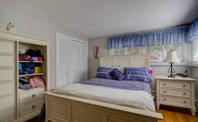 a bedroom with a bed and a closet