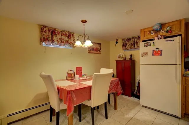 a kitchen with refrigerator and cabinets